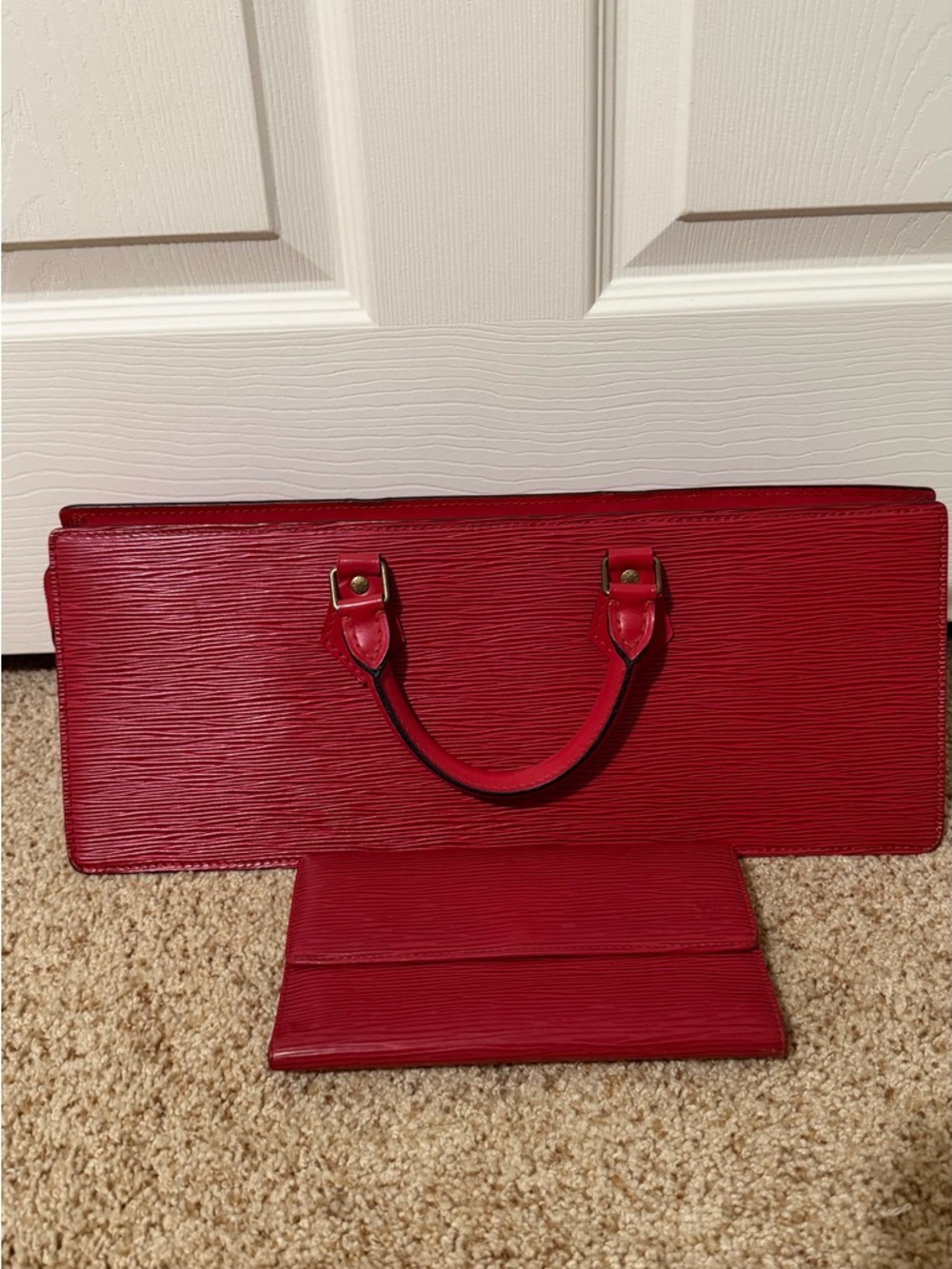 Louis Vuitton Epi Sac Triangle bag w/ matching wallet. Very unique bag.